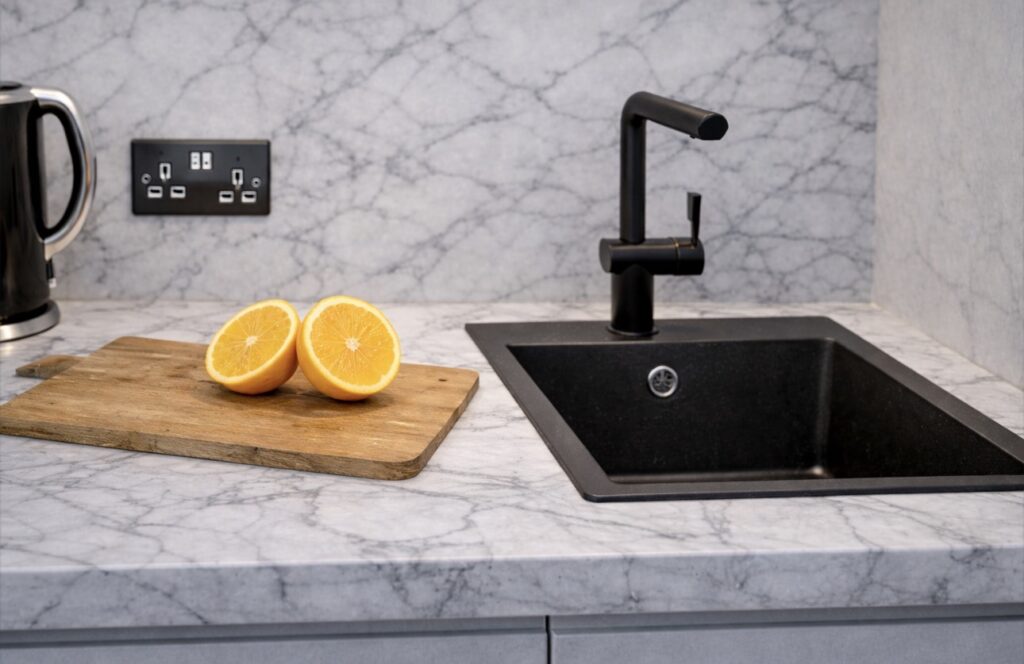 Calm Retreat suite at Haüss Coatbridge featuring neutral tones, integrated kitchenette and en suite in North Lanarkshire aparthotel