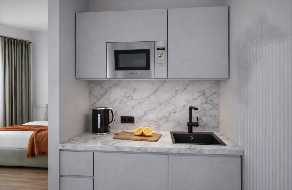 Calm Retreat suite at Haüss Coatbridge featuring neutral tones, integrated kitchenette and en suite in North Lanarkshire aparthotel